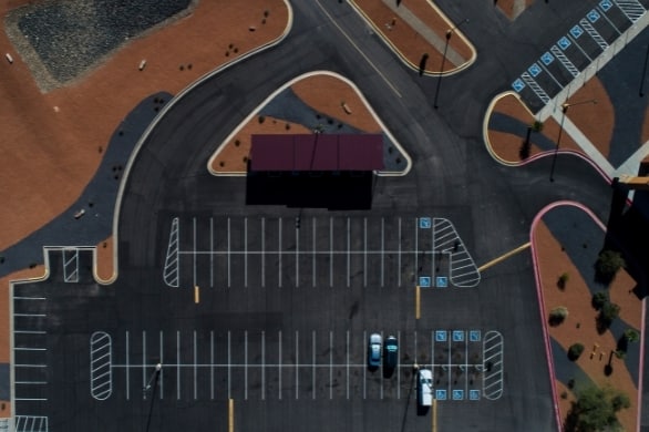 image of a birds eye view of a newly completed asphalt parking lot project. 